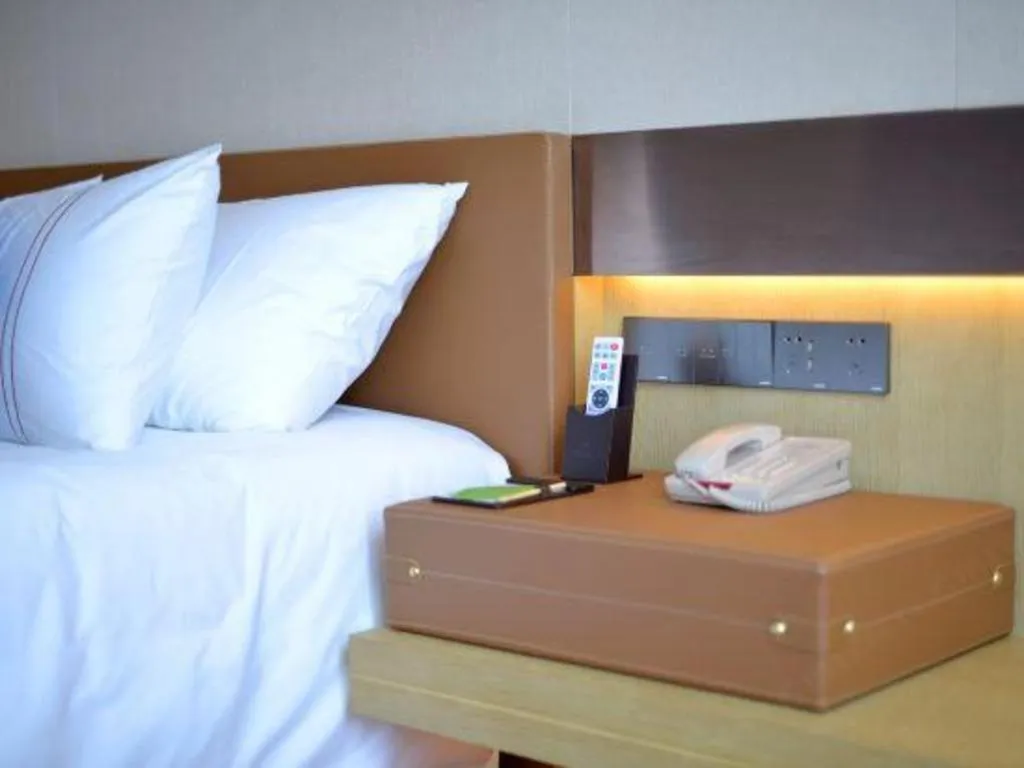 Bed in AUGUSTINE HOTEL