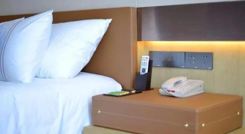 Bed in AUGUSTINE HOTEL