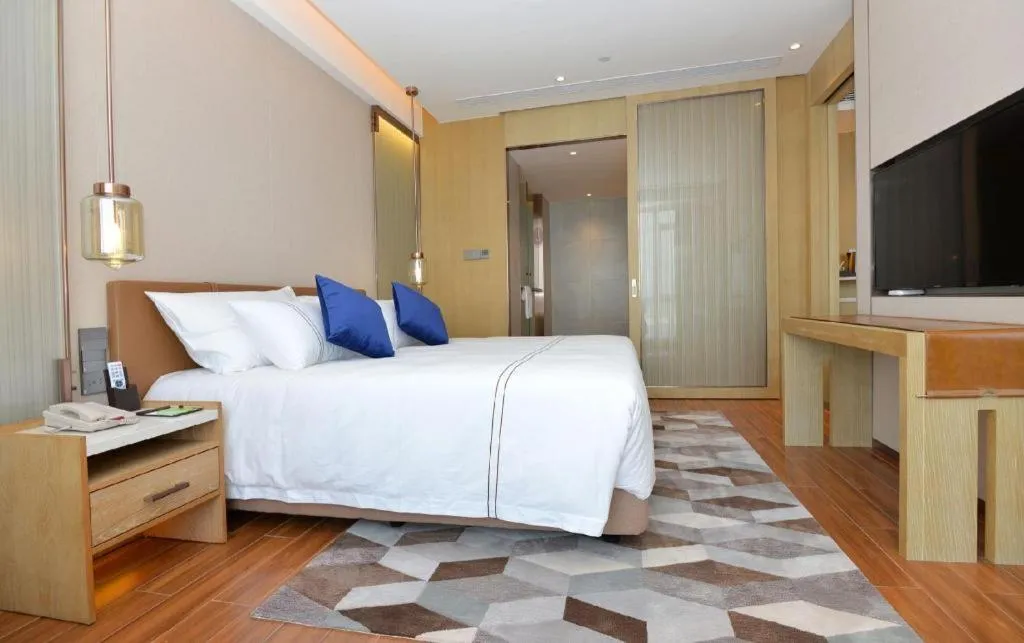 Bed in AUGUSTINE HOTEL