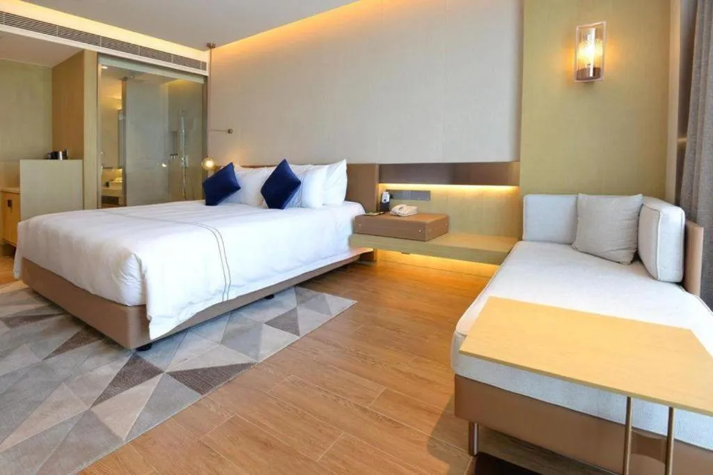 Bed in AUGUSTINE HOTEL