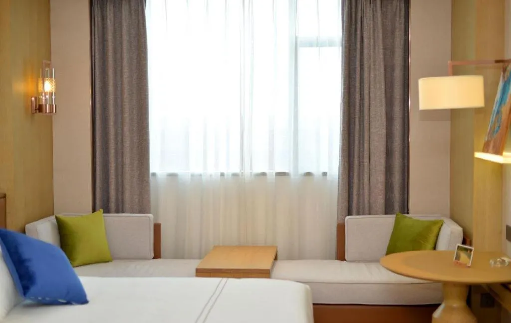 Bed in AUGUSTINE HOTEL