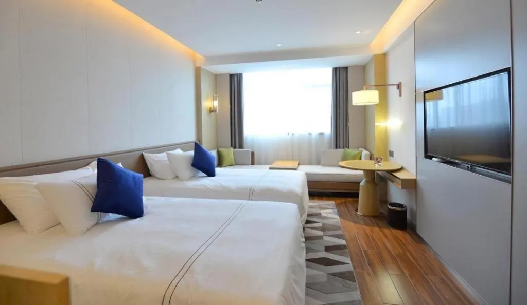 Bed in AUGUSTINE HOTEL