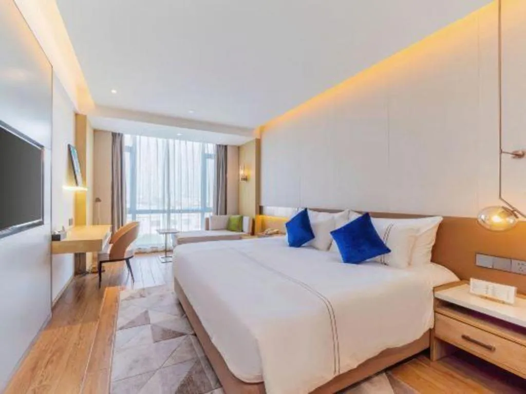 Bed in AUGUSTINE HOTEL