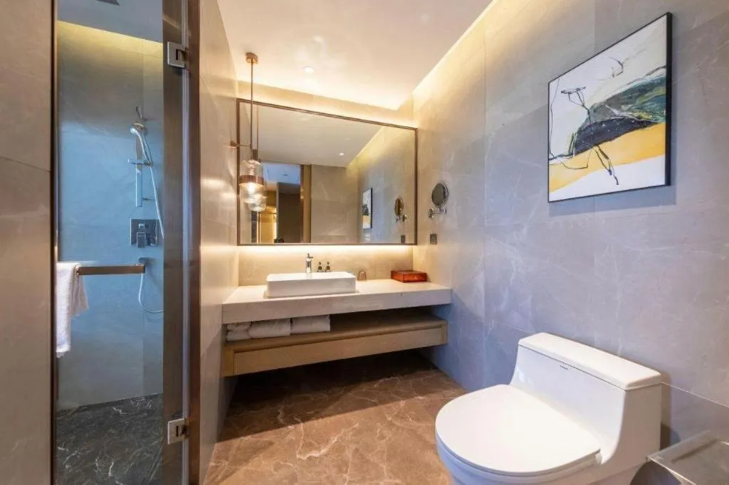 Bed in AUGUSTINE HOTEL