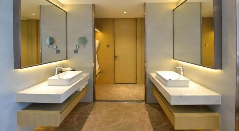 Bed in AUGUSTINE HOTEL