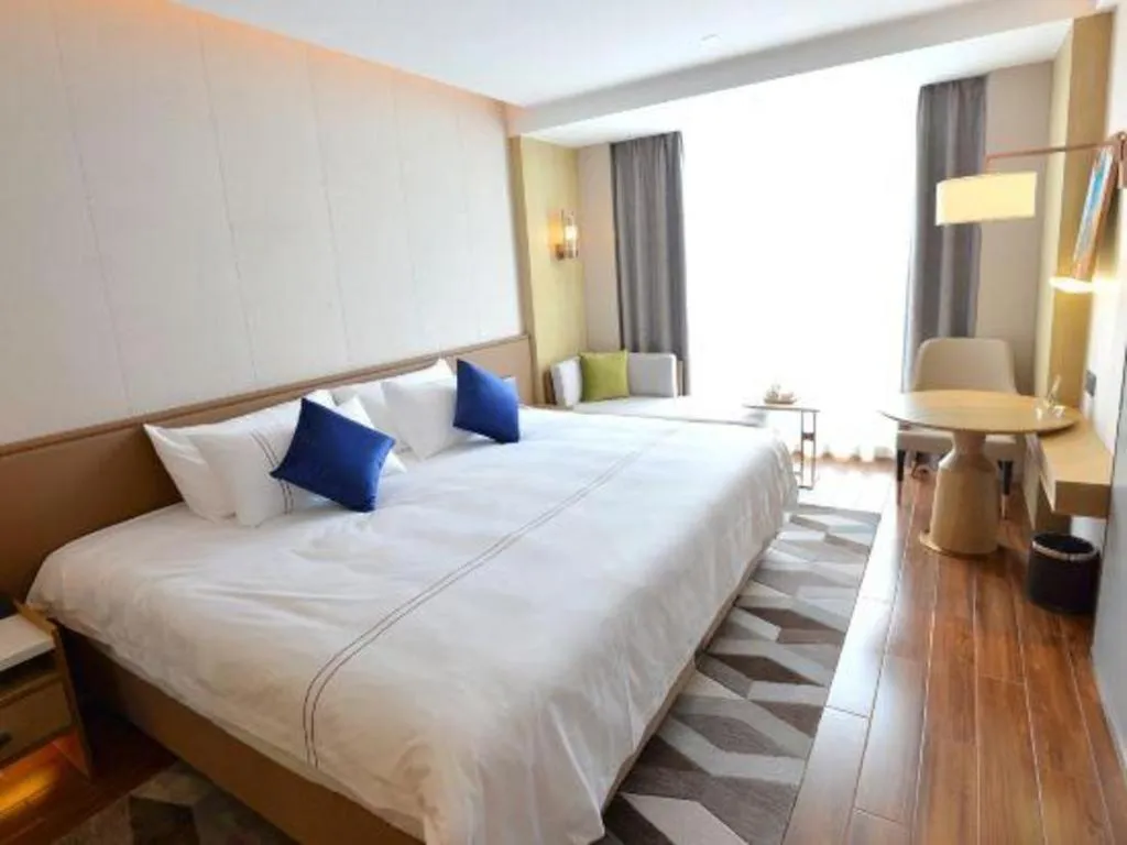 Bed in AUGUSTINE HOTEL