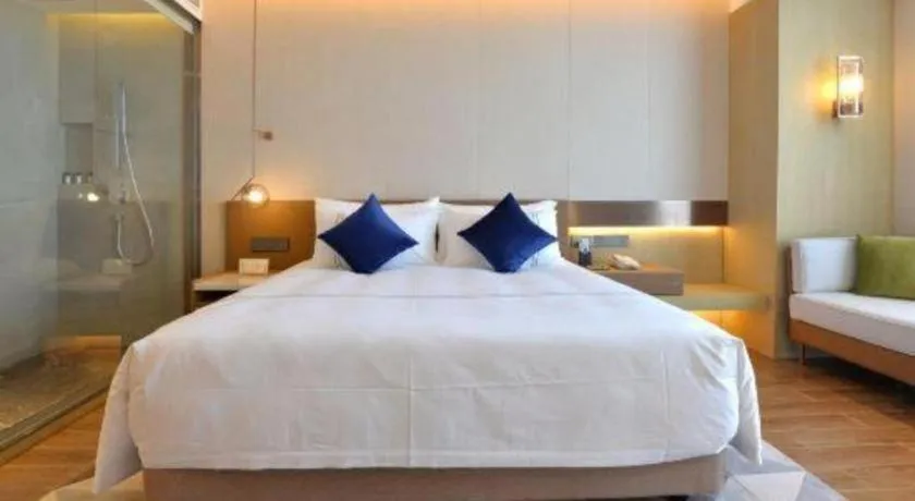 Bed in AUGUSTINE HOTEL
