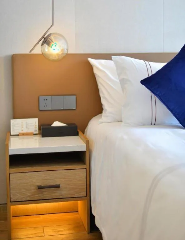 Bed in AUGUSTINE HOTEL