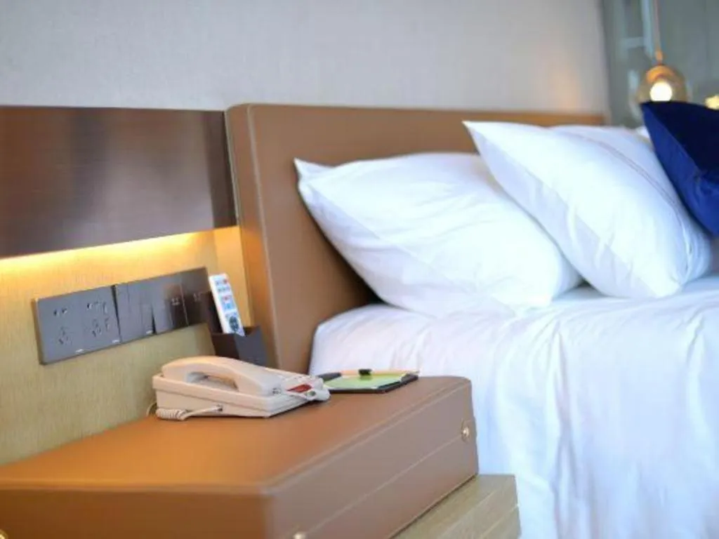 Bed in AUGUSTINE HOTEL