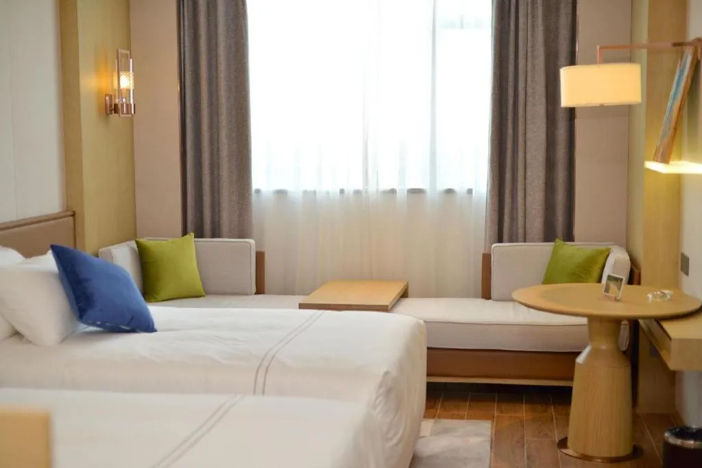 Bed in AUGUSTINE HOTEL