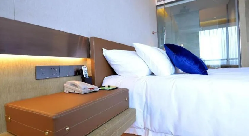 Bed in AUGUSTINE HOTEL