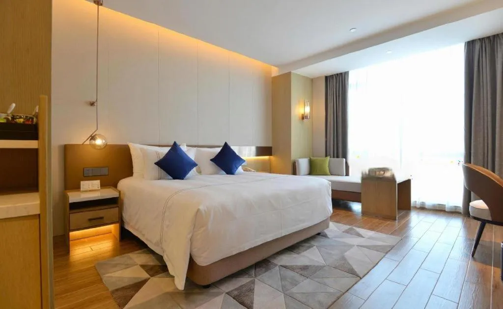 Bed in AUGUSTINE HOTEL