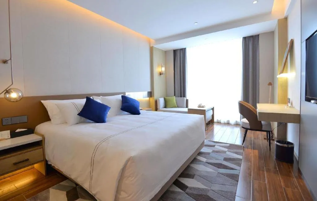 Bed in AUGUSTINE HOTEL