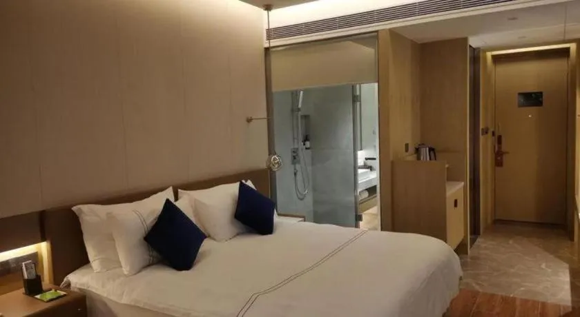 Bed in AUGUSTINE HOTEL