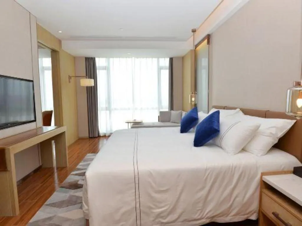 Bed in AUGUSTINE HOTEL