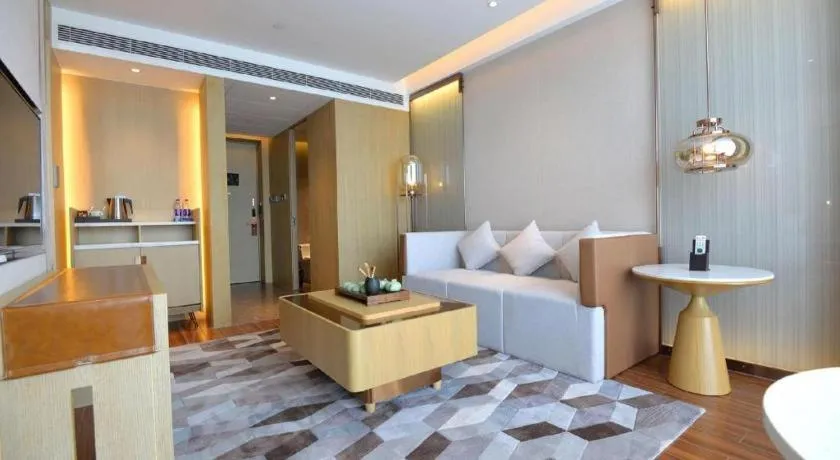 Bed in AUGUSTINE HOTEL