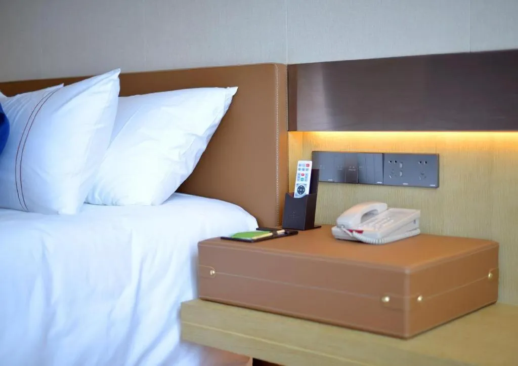 Bed in AUGUSTINE HOTEL