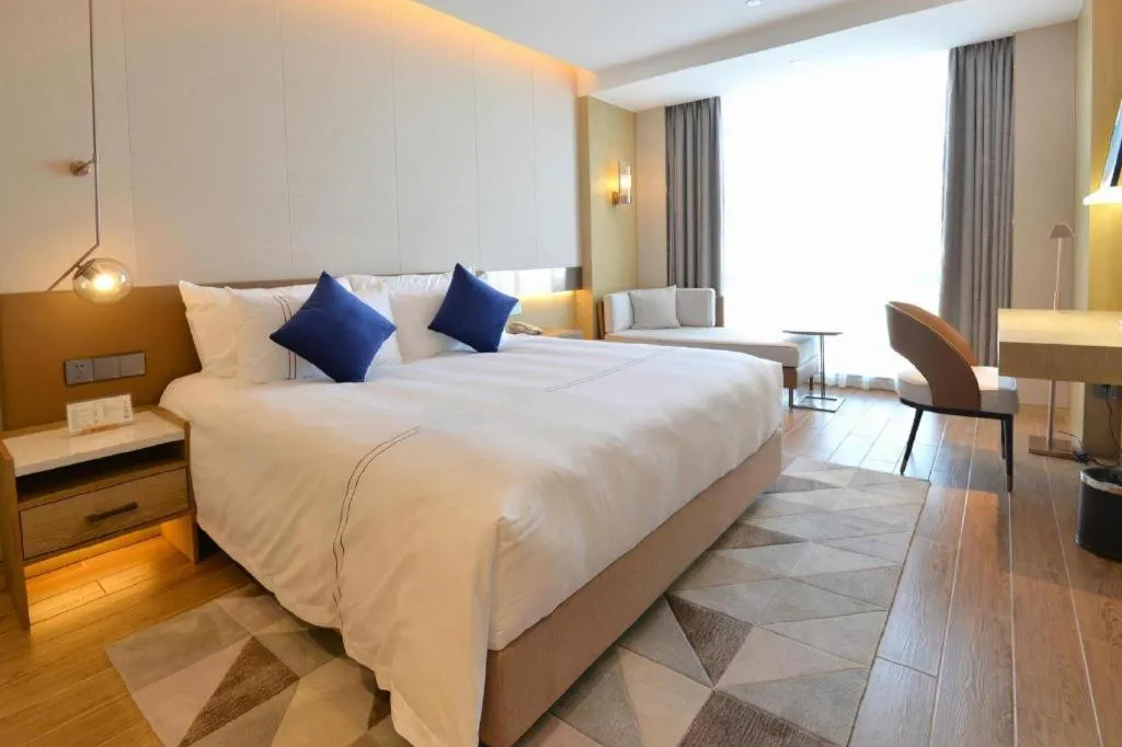 Bed in AUGUSTINE HOTEL