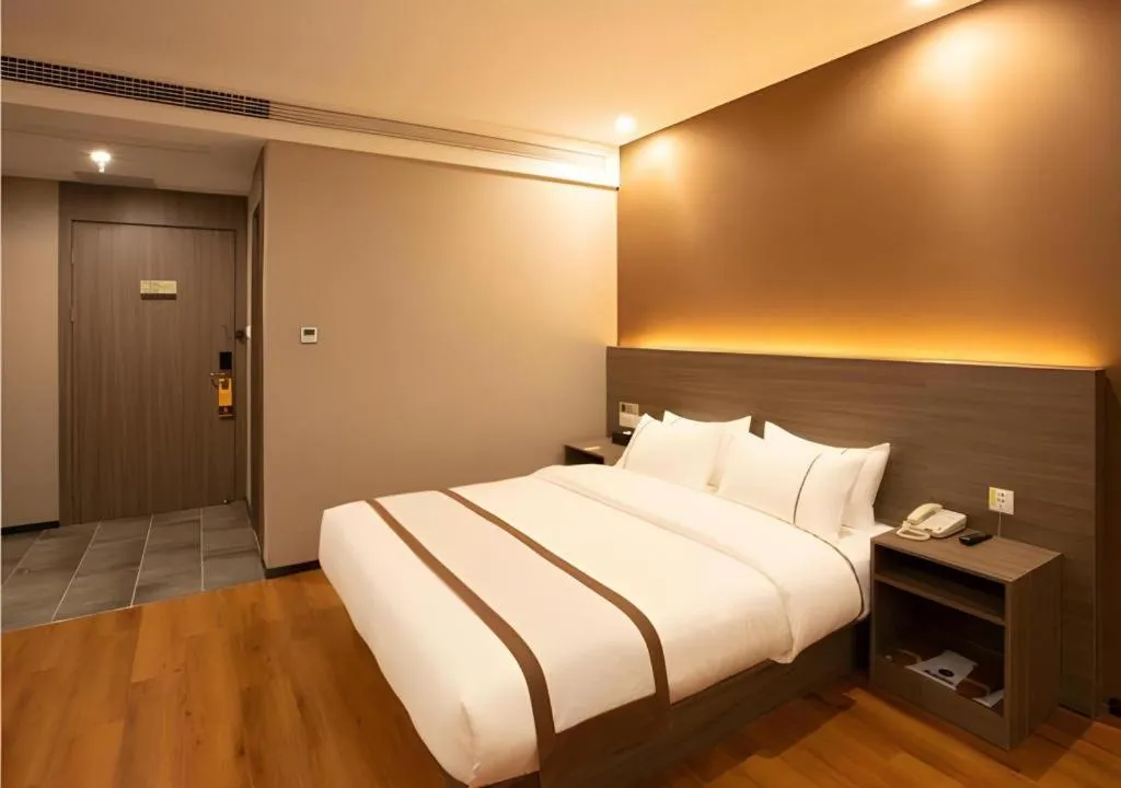 Bed in Jtour Inn Wuxi Meiyuan Kaiyuan Temple Metro