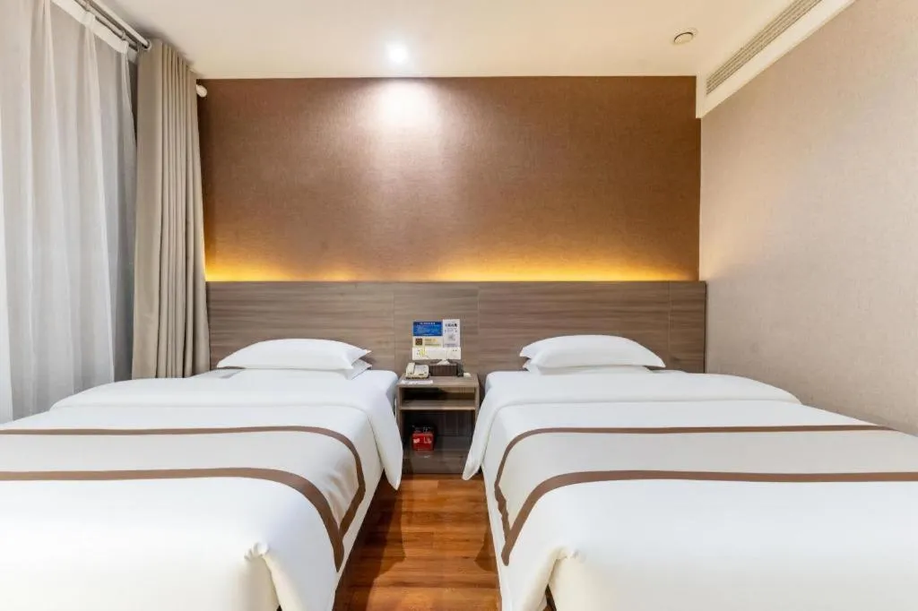 Bed in Jtour Inn Wuxi Meiyuan Kaiyuan Temple Metro