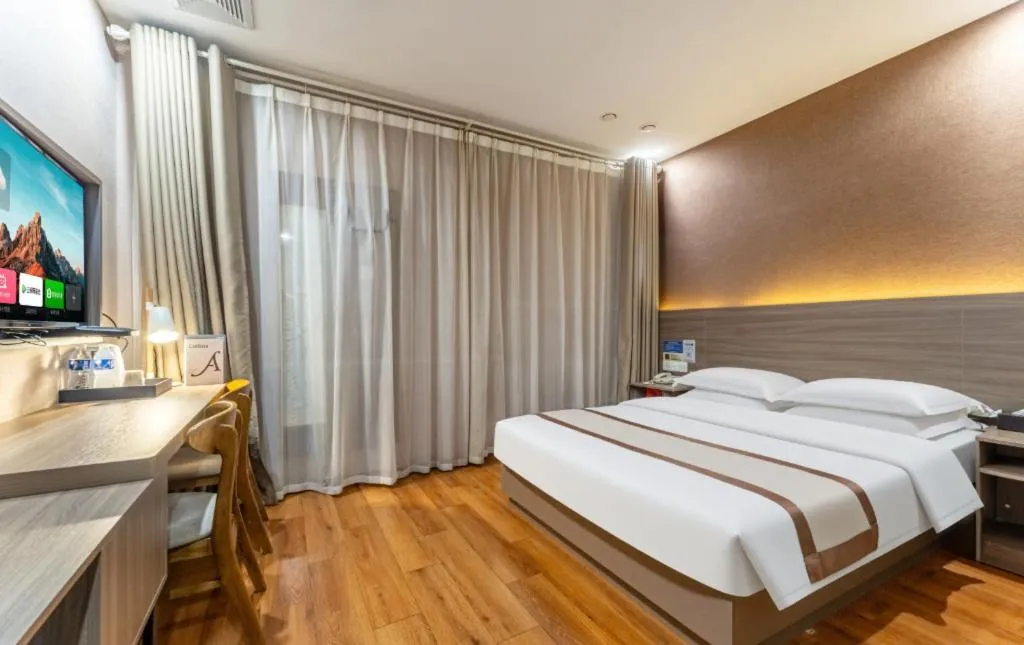 Bed in Jtour Inn Wuxi Meiyuan Kaiyuan Temple Metro