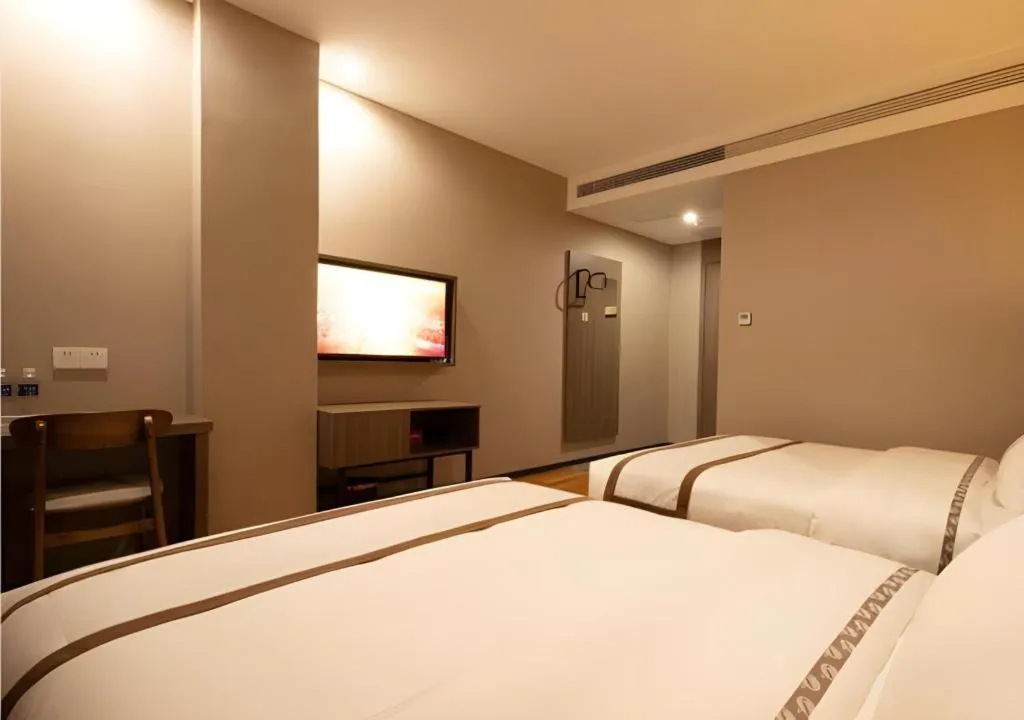 Bed in Jtour Inn Wuxi Meiyuan Kaiyuan Temple Metro