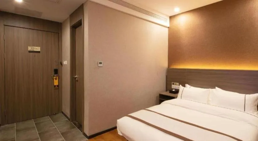 Bed in Jtour Inn Wuxi Meiyuan Kaiyuan Temple Metro