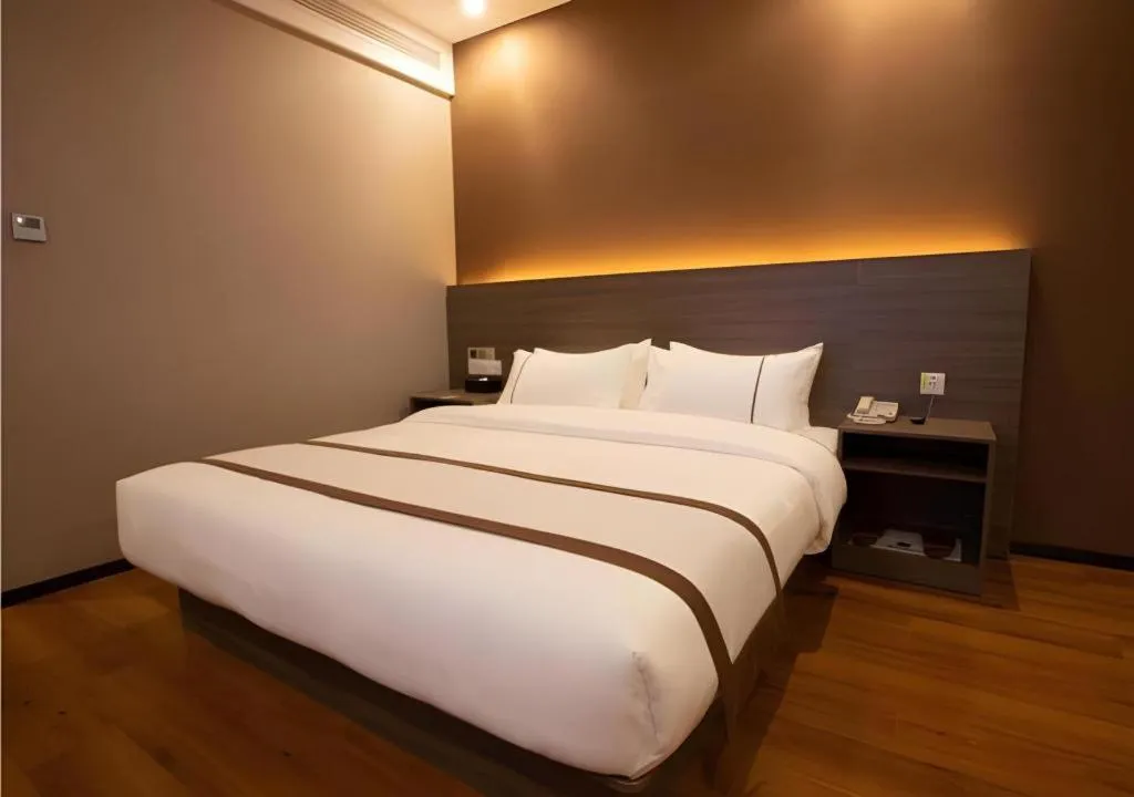 Bed in Jtour Inn Wuxi Meiyuan Kaiyuan Temple Metro