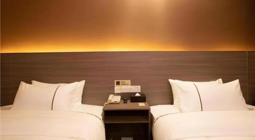 Bed in Jtour Inn Wuxi Meiyuan Kaiyuan Temple Metro