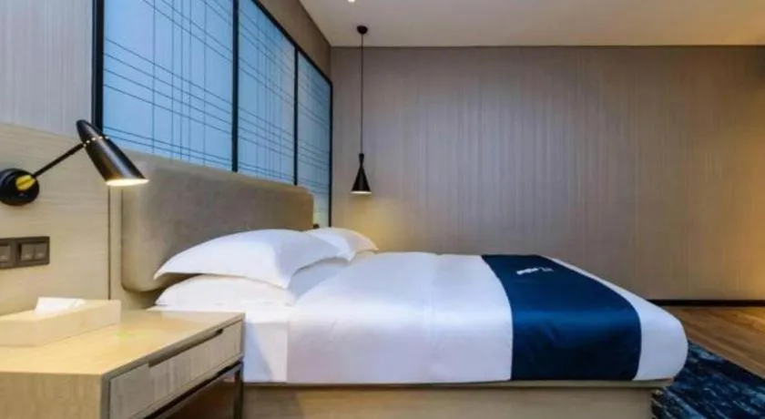 Bed in Echarm Hotel Guiyang Longdongbao International Airport Outlets