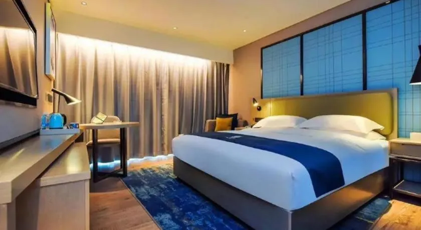 Bed in Echarm Hotel Guiyang Longdongbao International Airport Outlets