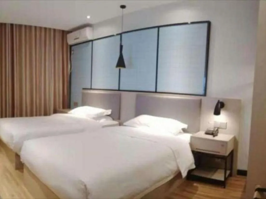 Bed in Borrman Hotel Hefei Guogou Plaza Sanli'an Metro Station