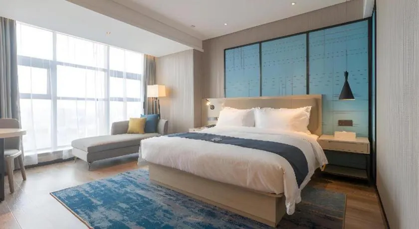 Bed in Echarm Hotel Aegean Shopping Park Zhonghuan Plaza