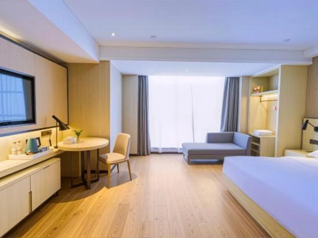 Bed in Echarm Hotel Aegean Shopping Park Zhonghuan Plaza