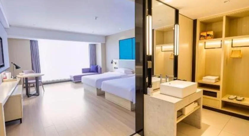 Bed in Echarm Hotel Aegean Shopping Park Zhonghuan Plaza