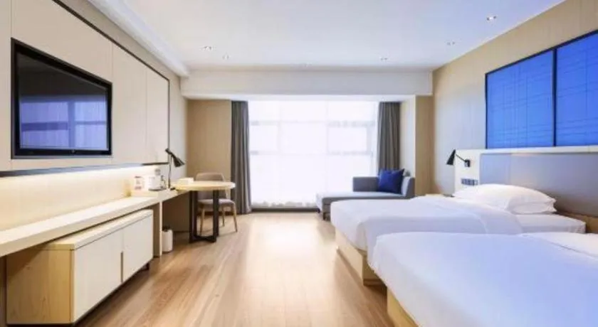 Bed in Echarm Hotel Aegean Shopping Park Zhonghuan Plaza