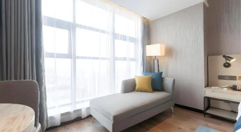 Bed in Echarm Hotel Aegean Shopping Park Zhonghuan Plaza