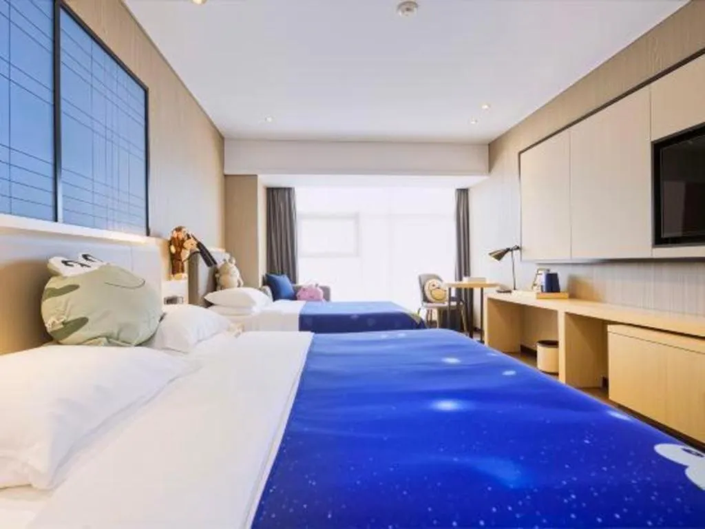 Bed in Echarm Hotel Aegean Shopping Park Zhonghuan Plaza
