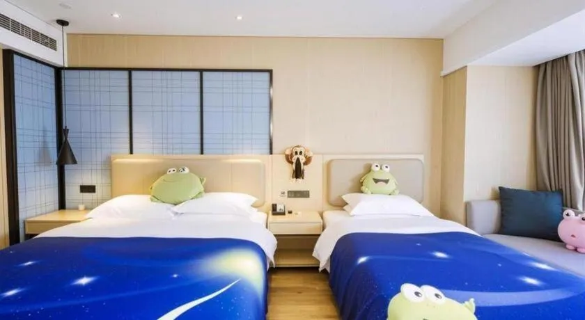 Bed in Echarm Hotel Aegean Shopping Park Zhonghuan Plaza
