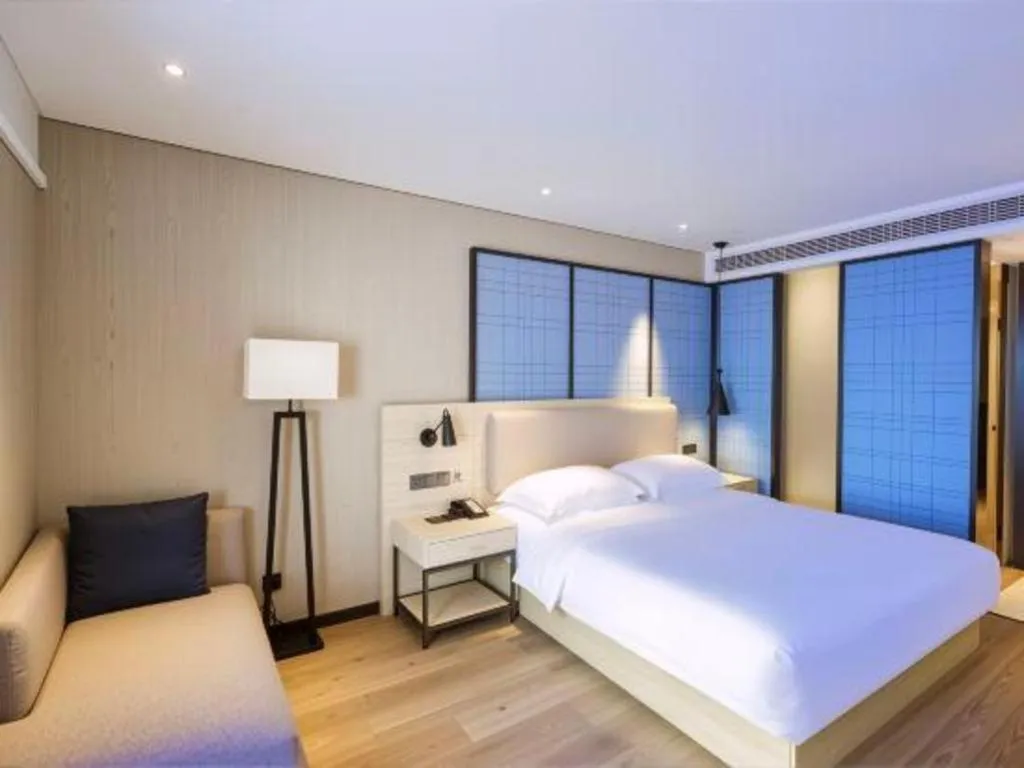Bed in Echarm Hotel Aegean Shopping Park Zhonghuan Plaza