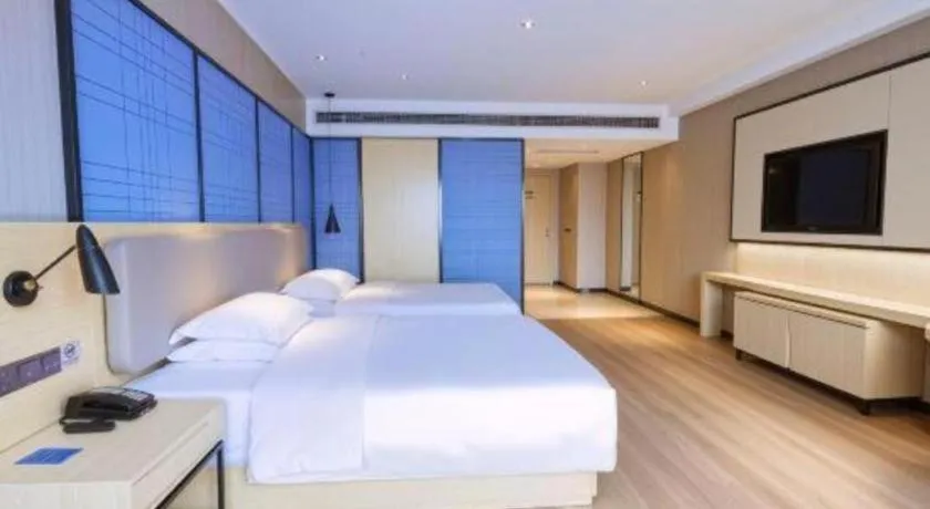 Bed in Echarm Hotel Aegean Shopping Park Zhonghuan Plaza