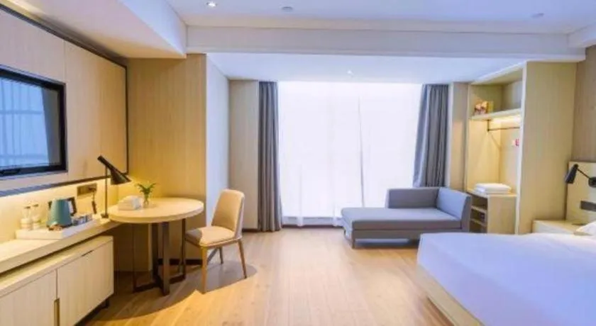 Bed in Echarm Hotel Aegean Shopping Park Zhonghuan Plaza