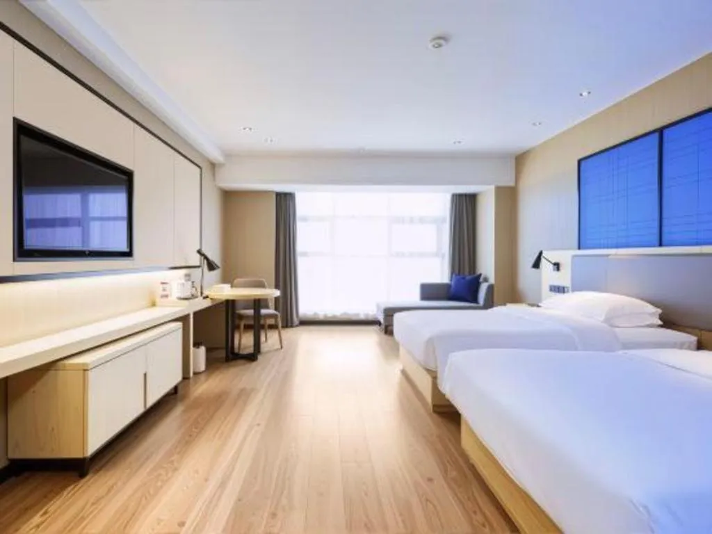 Bed in Echarm Hotel Aegean Shopping Park Zhonghuan Plaza
