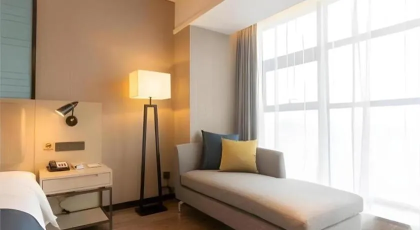 Bed in Echarm Hotel Aegean Shopping Park Zhonghuan Plaza
