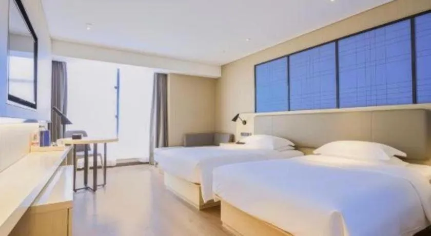 Bed in Echarm Hotel Aegean Shopping Park Zhonghuan Plaza