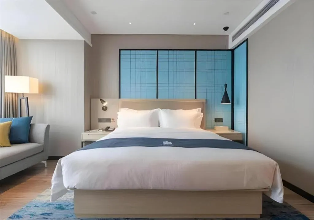 Bed in Echarm Hotel Aegean Shopping Park Zhonghuan Plaza