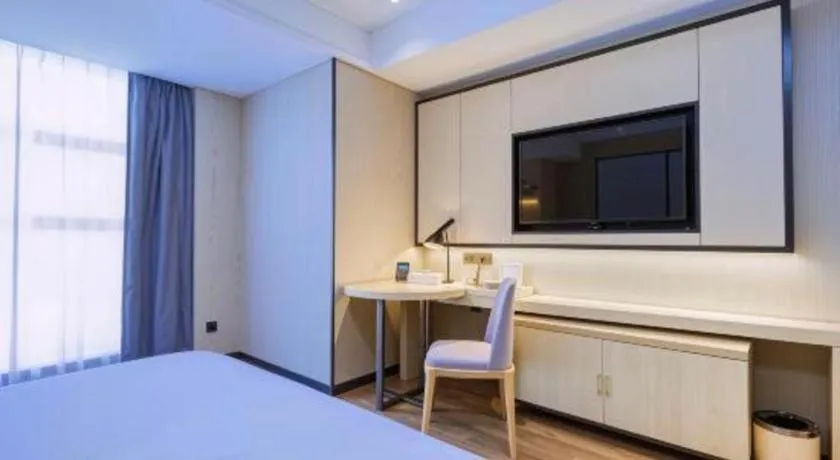 Bed in Echarm Hotel Aegean Shopping Park Zhonghuan Plaza