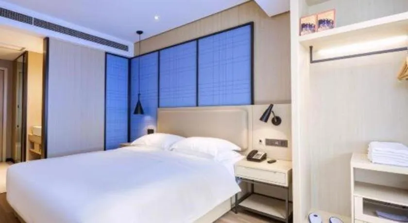 Bed in Echarm Hotel Aegean Shopping Park Zhonghuan Plaza
