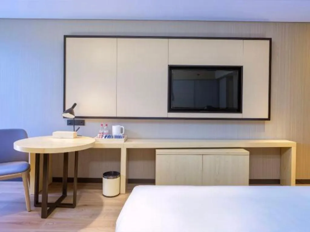 Bed in Echarm Hotel Aegean Shopping Park Zhonghuan Plaza