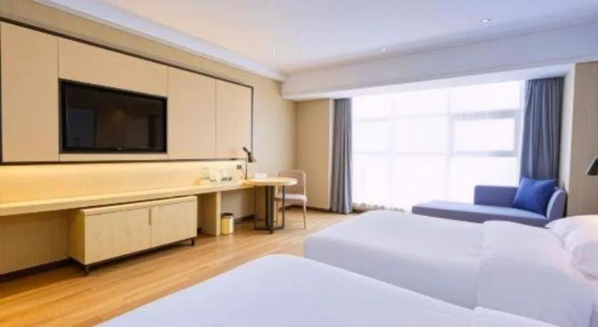 Bed in Echarm Hotel Aegean Shopping Park Zhonghuan Plaza